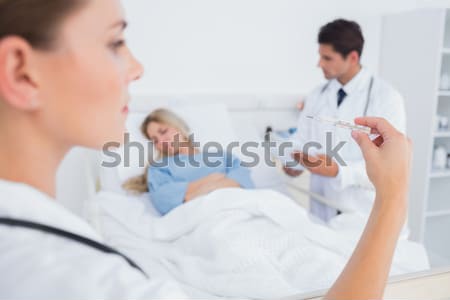 Doctor giving an injection to the patient Stock photo © wavebreak_media