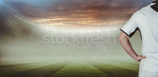 Composite image of rear view of rugby player with hands on waist Stock photo © wavebreak_media