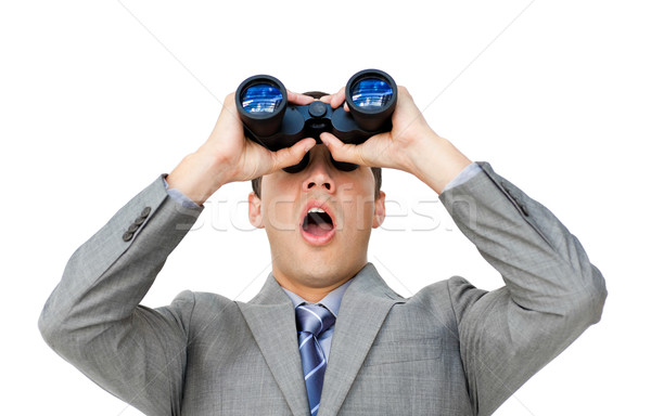 Surprised businessman looking through binoculars  Stock photo © wavebreak_media