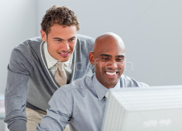 Charismatic business partners working at a computer together Stock photo © wavebreak_media