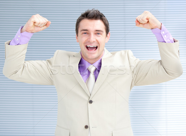 Jolly businessman puniching the air  Stock photo © wavebreak_media