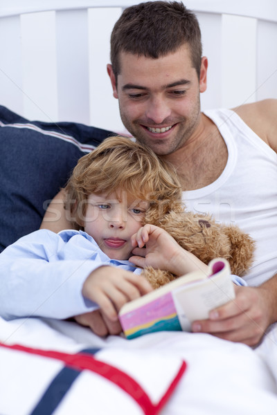 Little boy reading with his father a book  Stock photo © wavebreak_media