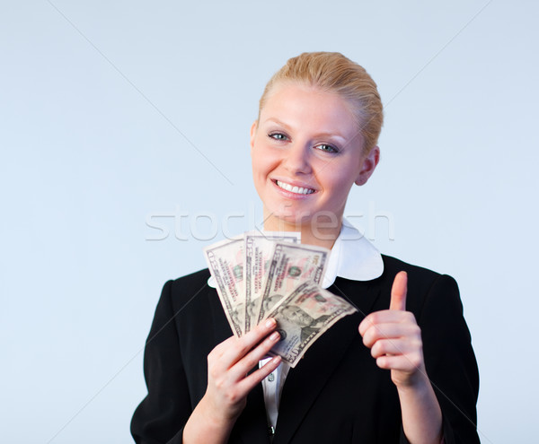 woman holding dollars with thumb up Stock photo © wavebreak_media