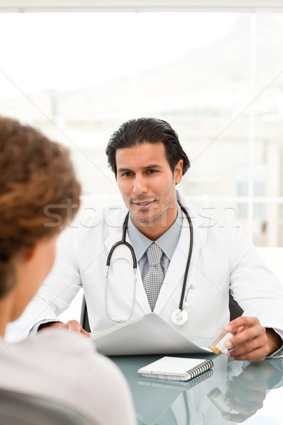 Rear view of a female patient during an appointment with her doctor at the hospital Stock photo © wavebreak_media