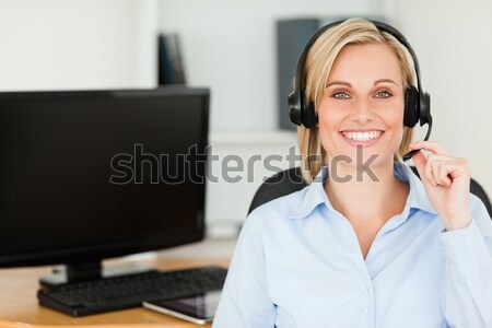 Close Up Of A Blonde Smiling Woman Wearing Headset Looking Into Camera In Her Office Stock Photo C Wavebreak Media Ltd Wavebreak Media Stockfresh