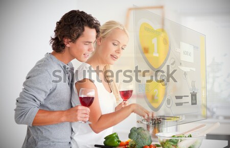 Couple cuisson verre vin cuisine femme Photo stock © wavebreak_media