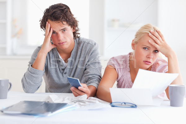 Worn down couple in their living room Stock photo © wavebreak_media