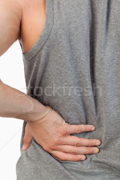 男 手 觸摸 自己的 背面 白 商業照片 © wavebreak_media