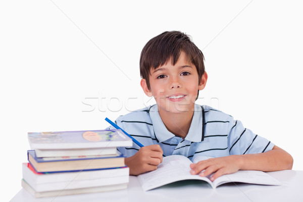 Jongen huiswerk witte hand glimlach boek Stockfoto © wavebreak_media