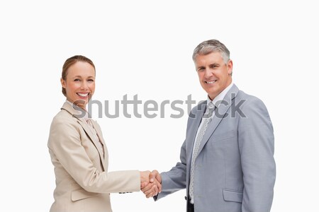 Portrait of business people shaking their hands against white background Stock photo © wavebreak_media