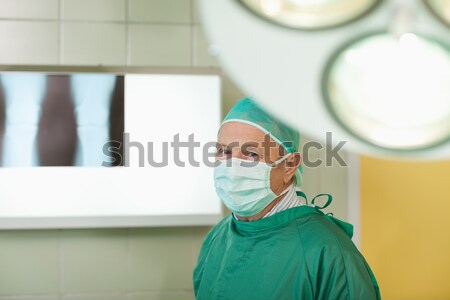 Surgeon looking at x-rays in a surgical room Stock photo © wavebreak_media