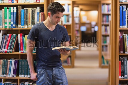 öğrenci ayakta kitaplık kütüphane düşünme kitap Stok fotoğraf © wavebreak_media