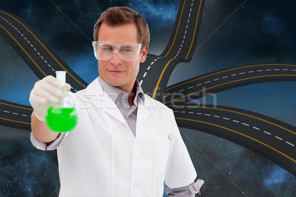 Composite image of young scientist working with a beaker Stock photo © wavebreak_media