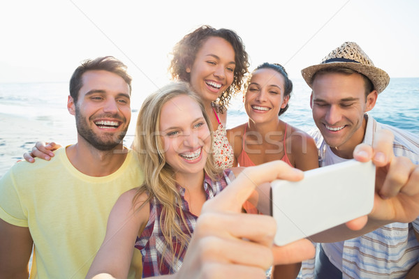 group of friends taking selfies  Stock photo © wavebreak_media