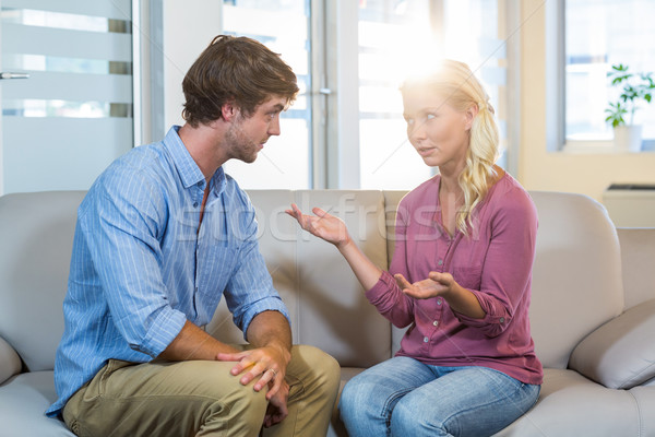 Unsmiling couple talking to each other Stock photo © wavebreak_media