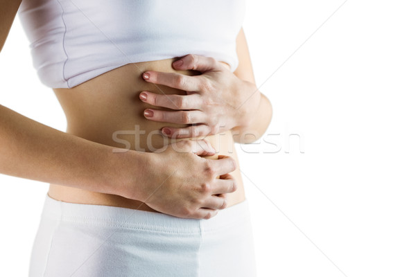 Stock photo: Slim woman touching her belly