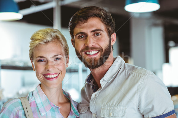 Stock photo: Cute couple on a date looking at the camera