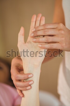 Young woman getting hand massage Stock photo © wavebreak_media