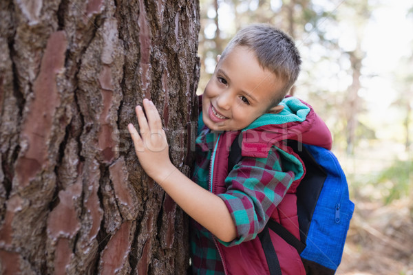 Portrait of happy boy embracing tree Stock photo © wavebreak_media