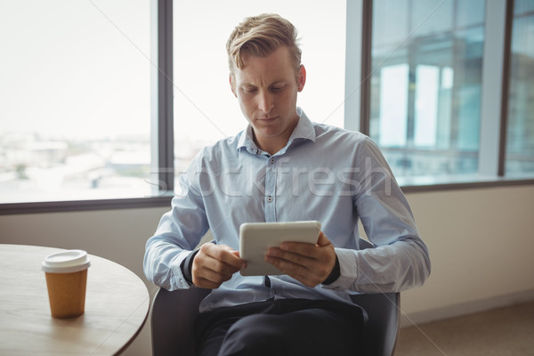 Attentive executive using digital tablet at table Stock photo © wavebreak_media