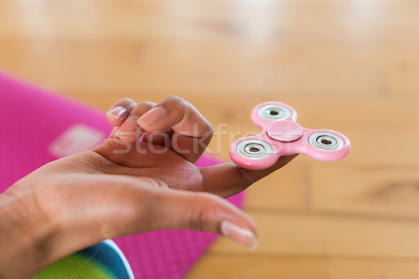 Girl holding a fidget spinner Stock photo © wavebreak_media