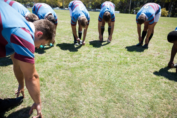 Close up of rugby players bending while standing at grassy field Stock photo © wavebreak_media
