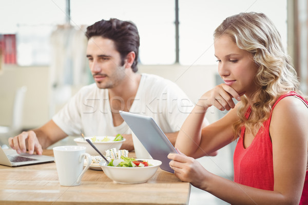 Femme d'affaires regarder numérique comprimé bureau Creative [[stock_photo]] © wavebreak_media