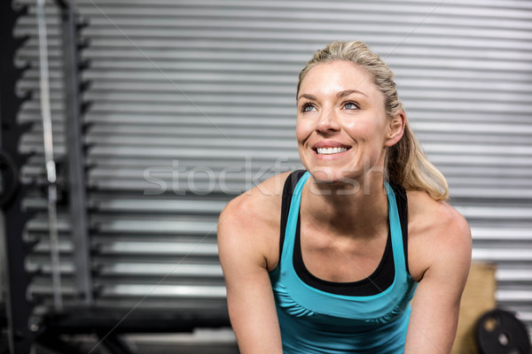 Sorridente caber mulher sessão crossfit ginásio Foto stock © wavebreak_media