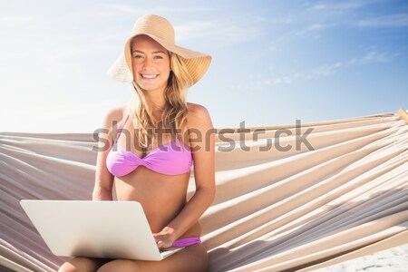 Fit brunette sitting on towel Stock photo © wavebreak_media