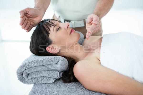 Stock photo: Pregnant woman receiving a massage from masseur