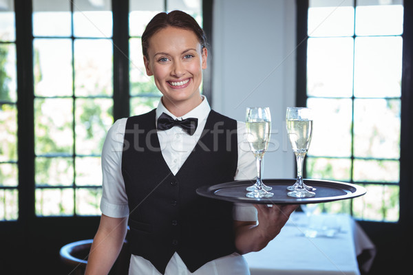 Zdjęcia stock: Kelnerka · taca · flet · szampana · restauracji · szczęśliwy