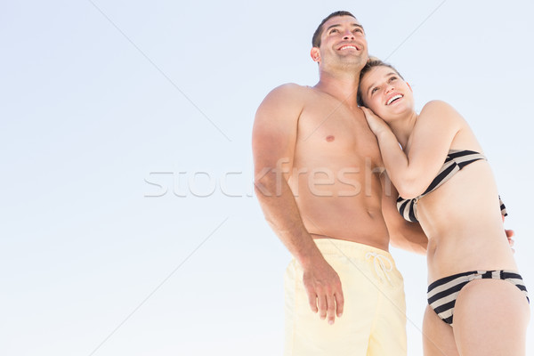 Smiling couple embracing on the beach Stock photo © wavebreak_media