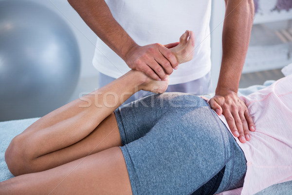Physiotherapist giving leg massage to a woman Stock photo © wavebreak_media