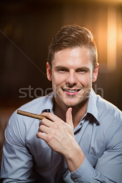 [[stock_photo]]: Souriant · homme · cigare · bar · portrait