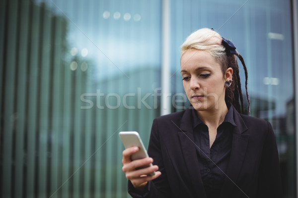 Businesswoman using mobile phone Stock photo © wavebreak_media