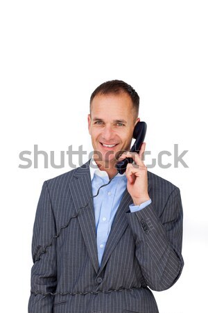 Smiling businessman tangled up in phone wires  Stock photo © wavebreak_media