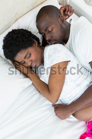 Caring lovers sleeping lying in the bed Stock photo © wavebreak_media