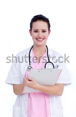 Portrait a positive female doctor writing notes  Stock photo © wavebreak_media
