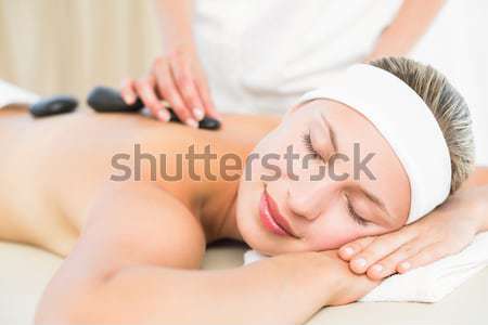 Sorridere massaggio pietre indietro fiore Foto d'archivio © wavebreak_media