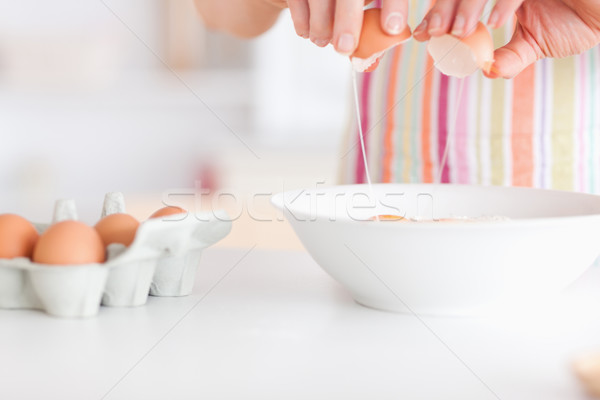 Stock photo: Woman with eggs and a bowl in an office