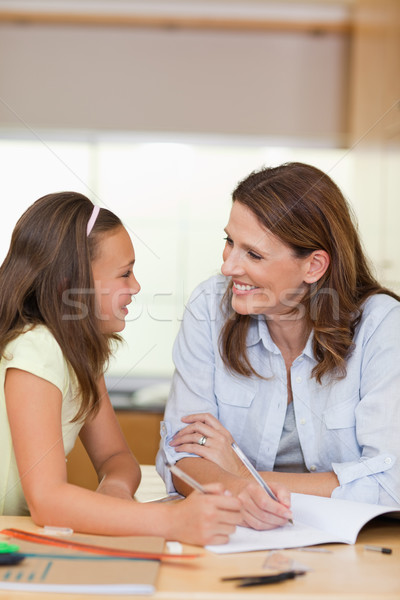 Stock photo: Woman doing homework together with her daughter