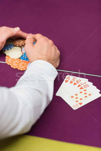 Man sitting grabbing chips close-up Stock photo © wavebreak_media