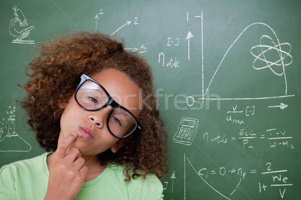 Composite image of cute pupil thinking Stock photo © wavebreak_media