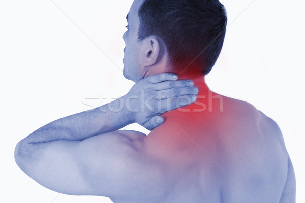 Young man experiencing neck pain Stock photo © wavebreak_media
