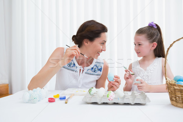 Mother and daughter painting easter eggs Stock photo © wavebreak_media