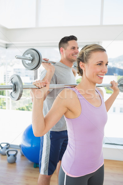 Geschikt vrouw man gewichten gelukkig Stockfoto © wavebreak_media