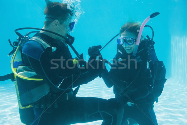Man proposing marriage to his shocked girlfriend underwater in s Stock photo © wavebreak_media