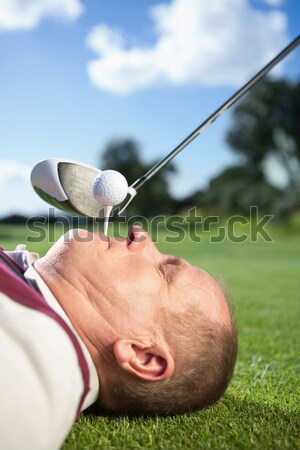 Golfer holding tee in his teeth Stock photo © wavebreak_media