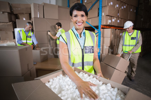Warehouse workers in yellow vests preparing a shipment Stock photo © wavebreak_media