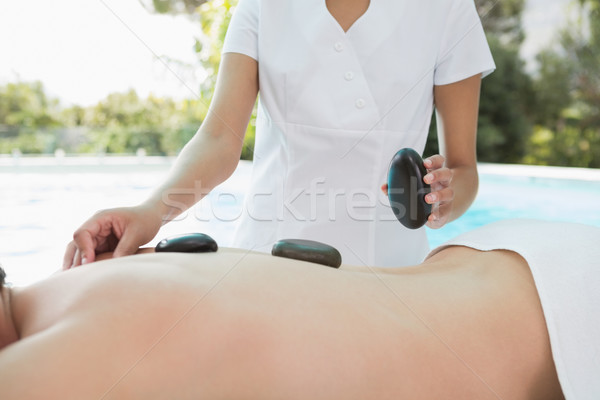 Człowiek kamień masażu spa centrum Zdjęcia stock © wavebreak_media